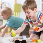 boys playing with construction toys in childcare